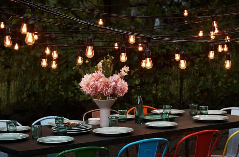 String lights over table with flowers