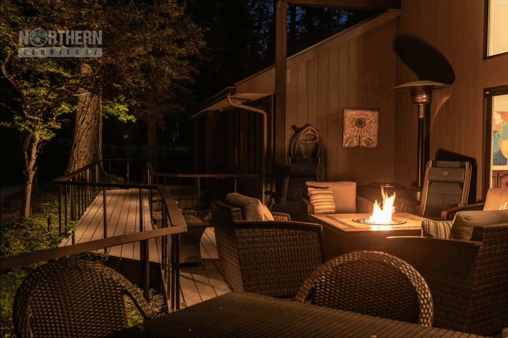 Backyard patio with fireplace and seating